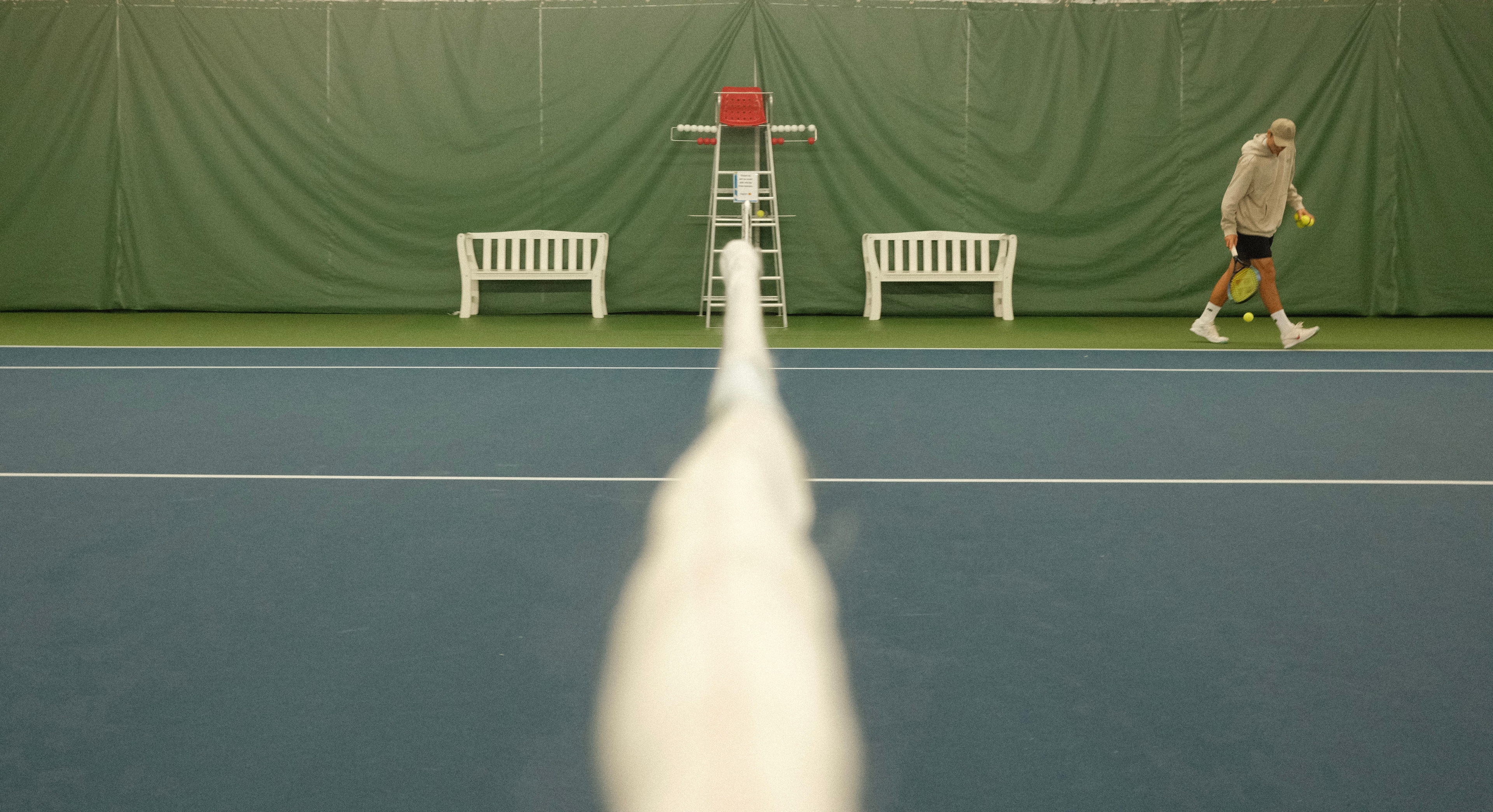 Playing tennis on an outdoor court